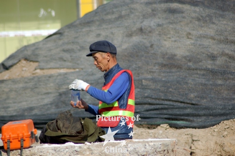 Worker going out from earth