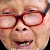 Beijing : An old woman singing