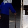 The old woman enters her home, Jinhong (Yunnan)