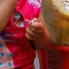 Little girl and her peanuts, Xining (Qinghai)